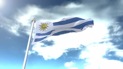 Waving Flag of Uruguay Against a Bright Cloudy Sky