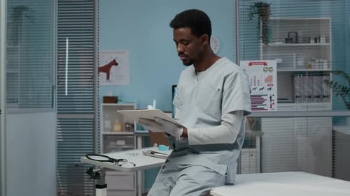 Portrait of Young African American Male Vet in Modern Clinic