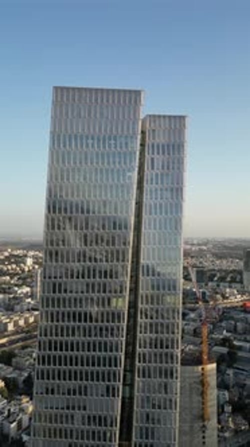 Aerial Shot Of Cityscape By Sea Against Sky At Sunset, Drone Descending Forward Over City - Tel Aviv