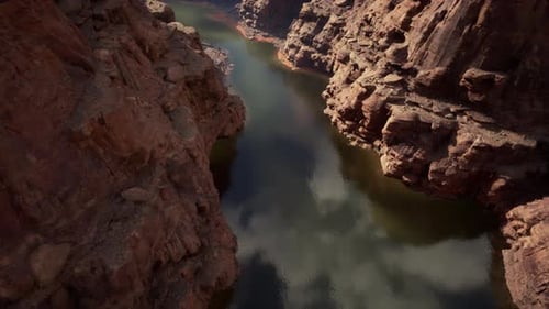 Bird'seye View of a Majestic River Flowing Through a Stunning Canyon Landscape