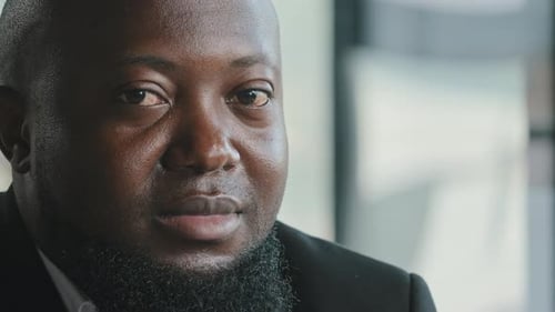 Close Up of Smiling Man in Business Attire