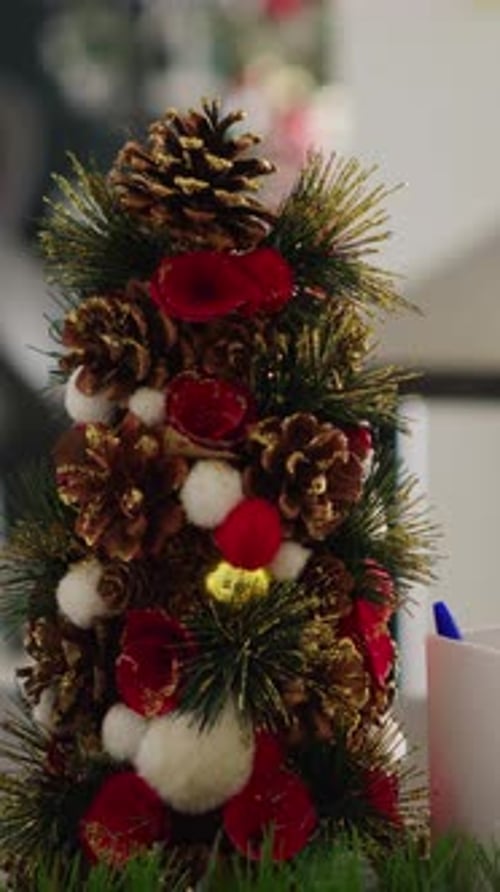 Vertical Video Miniature Christmas Tree in Office