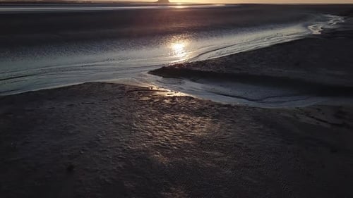 Mont Saint Michel abbey medieval castle in Normandy Bretagne France. Gothic island fortification sun