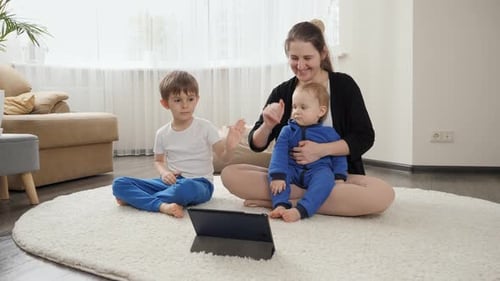 Mother and Children Meditating with Tablet