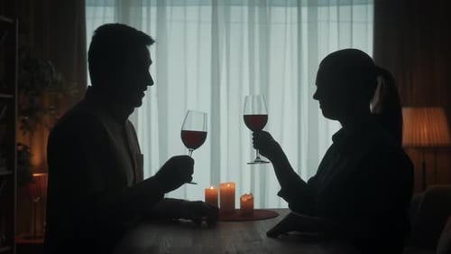 Romantic Couple Celebrating with Wine Silhouette
