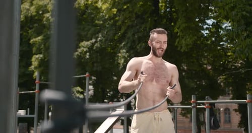 Man Exercising Outdoors with Resistance Band