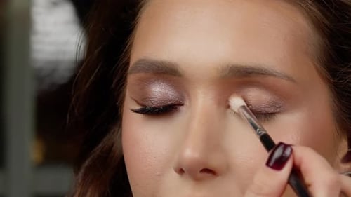 Woman Getting Eye Shadow Applied, Close Up
