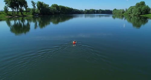 Person Swimming in River Aerial View