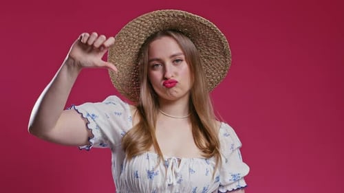 Woman Gives Thumbs Up and Thumbs Down Gesture