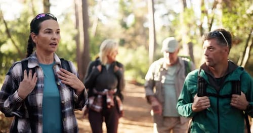 Hiking, adventure and mature group in woods, walking and journey for backpacking