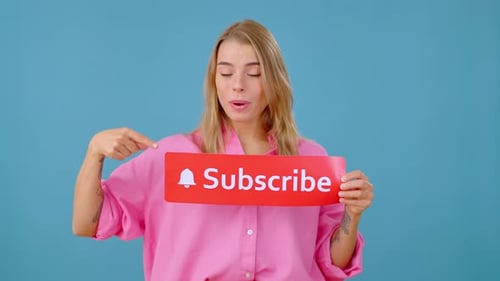 Blonde Woman Presenting Subscribe Sign and Pointing