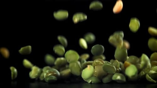 Green Peas Fall on the Table Filmed on a Highspeed Camera at 1000 Fps