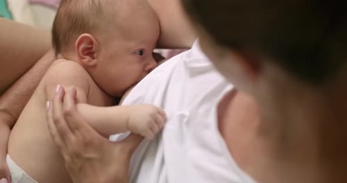 Tender Moment Between an Infant and Parent