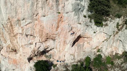 Rock climber climbing the rock 7