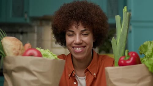 Portrait of Black Woman with Shopping Bags with Groceries