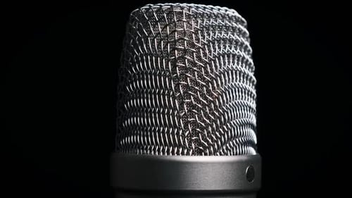 The Studio Condenser Microphone Rotates on a Black Background CloseUp
