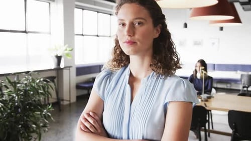 Portrait of happy caucasian casual businesswoman in office, slow motion