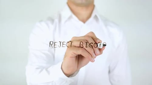 Man Writes 'Reject Bigotry' On Clear Surface
