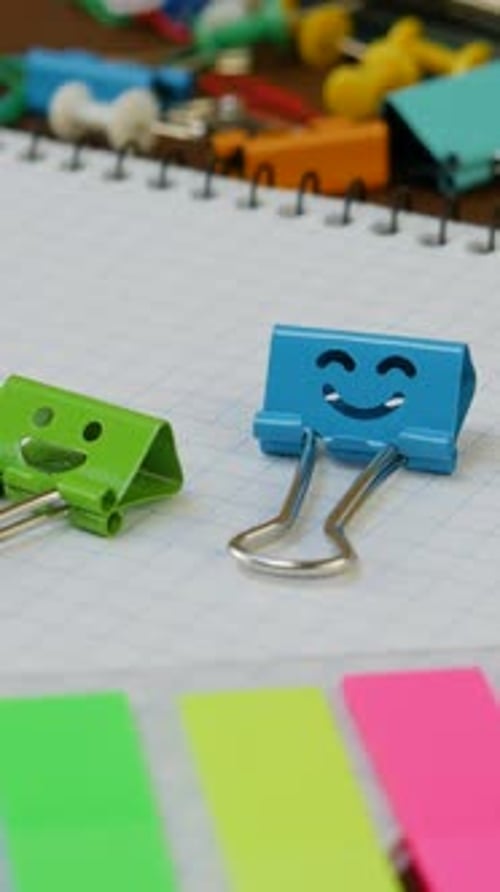 Scattered Office and School Supplies on Workspace