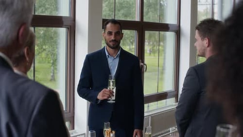 Young Man Speaking during Business Event