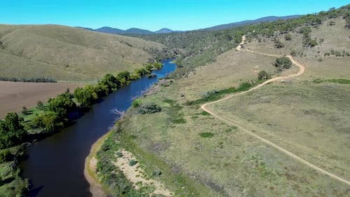 Drone aerial landscape of Murrumbidgee River water creek stream in Bredo valley with mountains trees