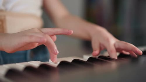 Child Plays Piano Close Up