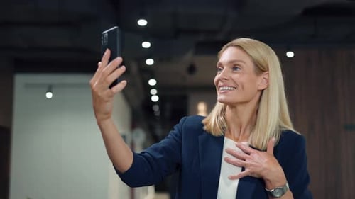 Business Woman Video Conferencing On Mobile Phone
