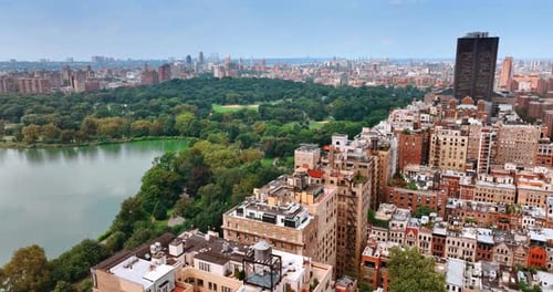 Cityscape of New York on sunny clear day. Beautiful green Central Park scenery from the top.