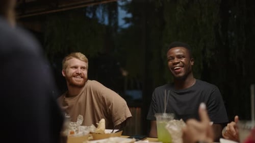 Multiethnic Young Guys Laughing And Chatting On Friends Meeting In Cafe In Weekend