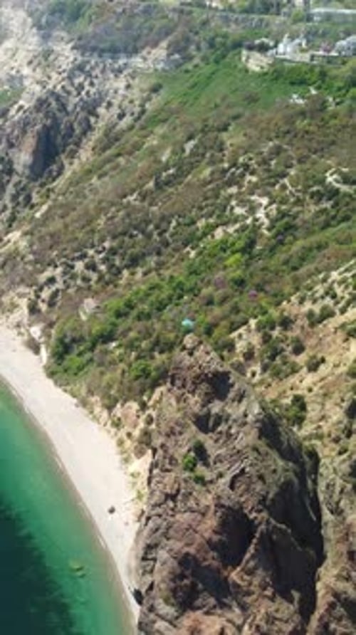 Aerial Vertical View of Seascape with Crystal Clear Calm Azure Sea and Rocky Shores A Beautiful