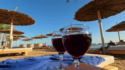 Beautiful lady in bikini walkings to the beach bed to chears. Timelapse shot