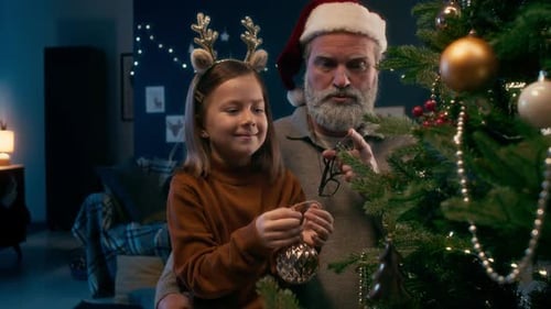Little Girl Hanging Christmas Bauble on Pine Tree Decorating it with Grandpa