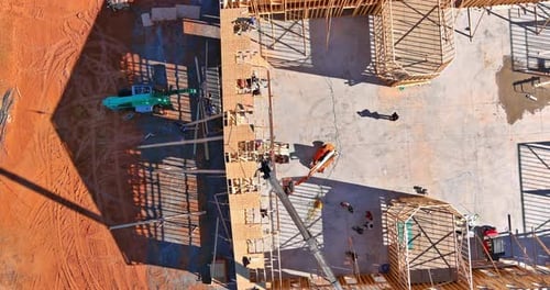 Wooden Roofing Trusses are Installed with Help of Crane at a New Residential Building