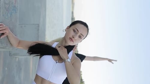 Women Stretching Together Outdoors on Sunny Day