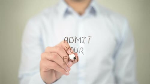 Admit Your Flaws Man Writing on Transparent Screen