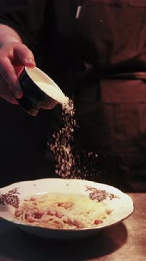 Vertical Cheese Sprinkle Spaghettis Parmesan Chef
