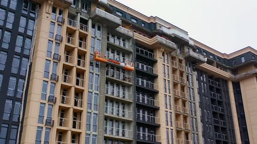 Building of new tower architecture. Modern multi storey building under construction.