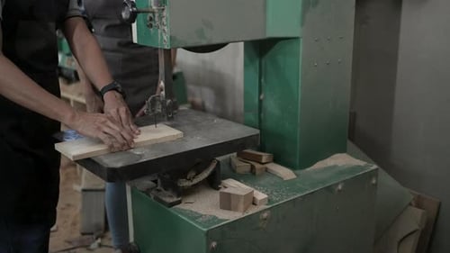 Carpenter are working at workshop.