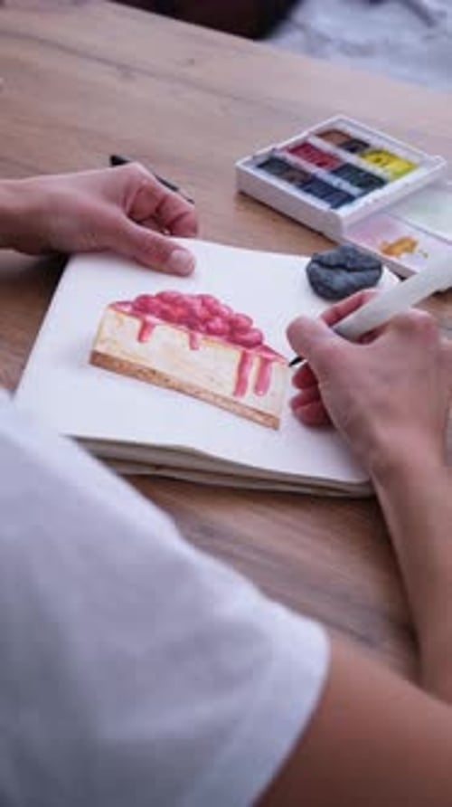 young woman drawing watercolor picture