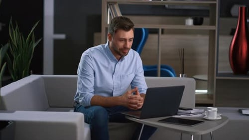 Successful ceo talking in webcam video chat with colleagues in modern office