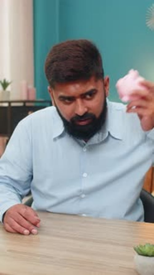 Indian Man Shakes Empty Piggy Bank Showing Despair Over Bankruptcy Debt Seeking Cash Money Loss Sad