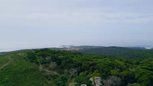 Beautiful Green Hills Cloudy Summer Day. Aerial View Mountain Slopes Covered Lush