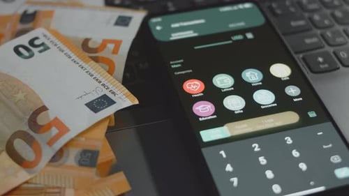 Smart Money Management Using Technology to Track Budget A Person Who Uses a Cell Phone to Do Their