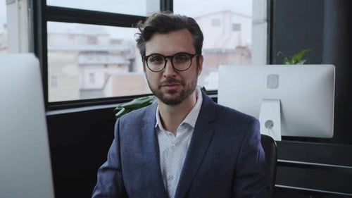 Dedicated and Focused Professional Actively Working in a Contemporary Office Environment