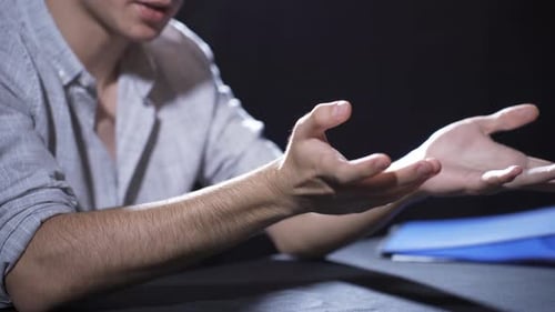 Interrogation Room: Young Adult Arrested and Handcuffed