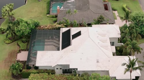 Aerial Above Footage of Screened in Pool and Lanai in Florida House Drone Shot