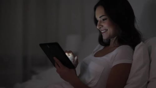 Technology Internet Communication and People Concept - Happy Smiling Young Woman With