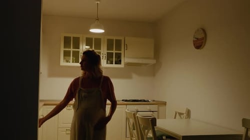 Pregnant Woman Gets Midnight Snack in Kitchen