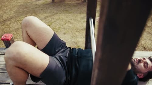 Man Trains His Abs At The Park During The Day