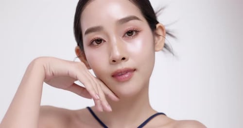 Slow motion of beautiful young Asian girl with k-beauty make up style.